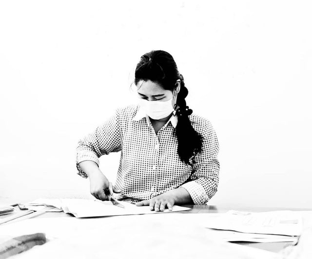 woman cutting fabric